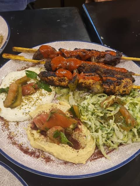 Chicken kebab plate with hummus